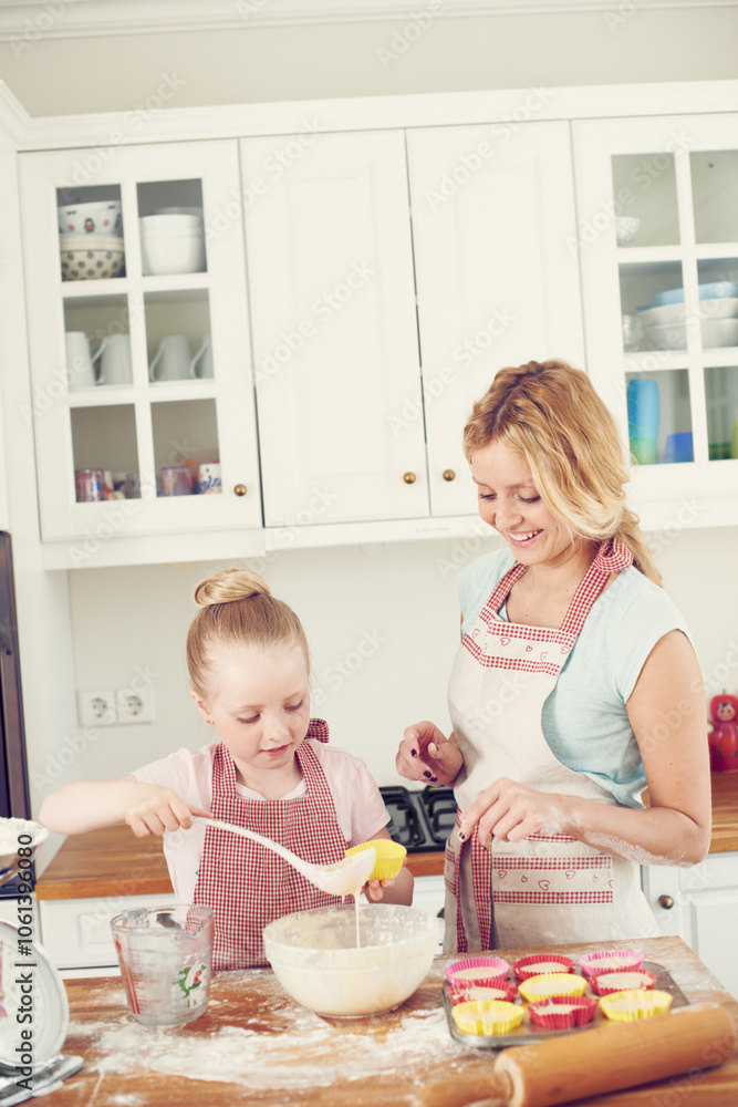 Help, cupcake and girl in kitchen with mom, baking and learning for morning bonding together. Love, mother and daughter with child development, ingredients and recipe mix in home for happy kid baker Help, cupcake and girl in kitchen with mom, baking and learning for morning bonding together. Love, mother and daughter with child development, ingredients and recipe mix in home for happy kid baker