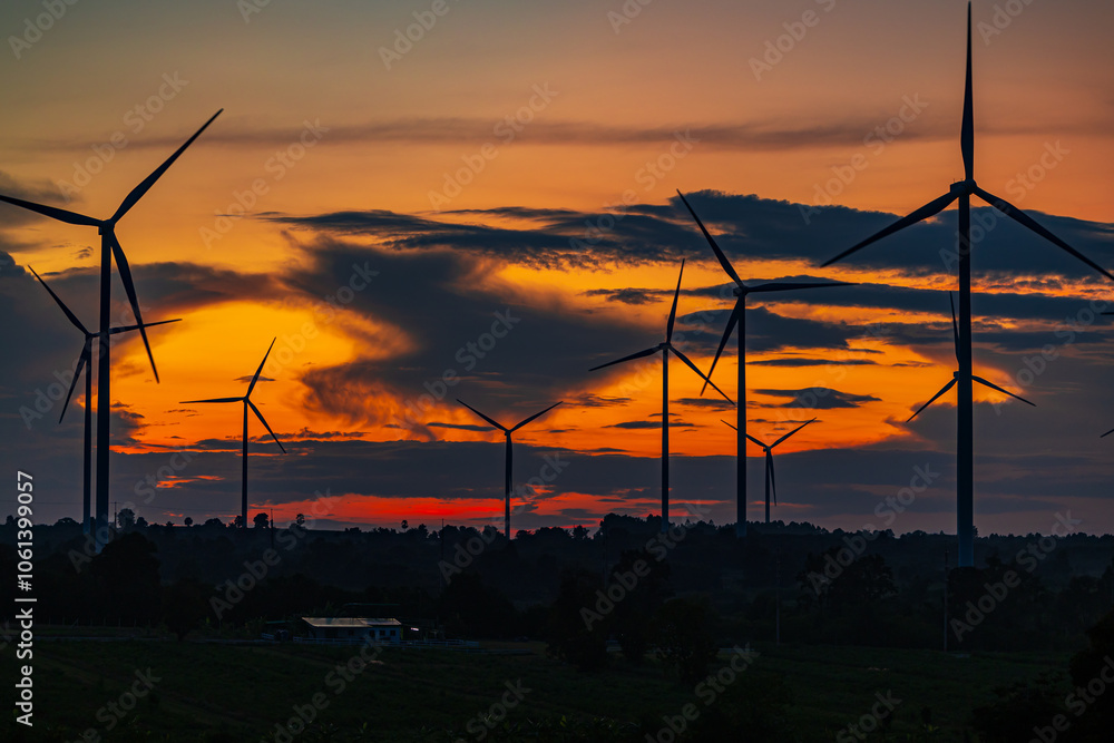 Obraz premium Wind turbine in sunset. renewable energy.renewable energy to businesses, homes, and public buildings.smart city