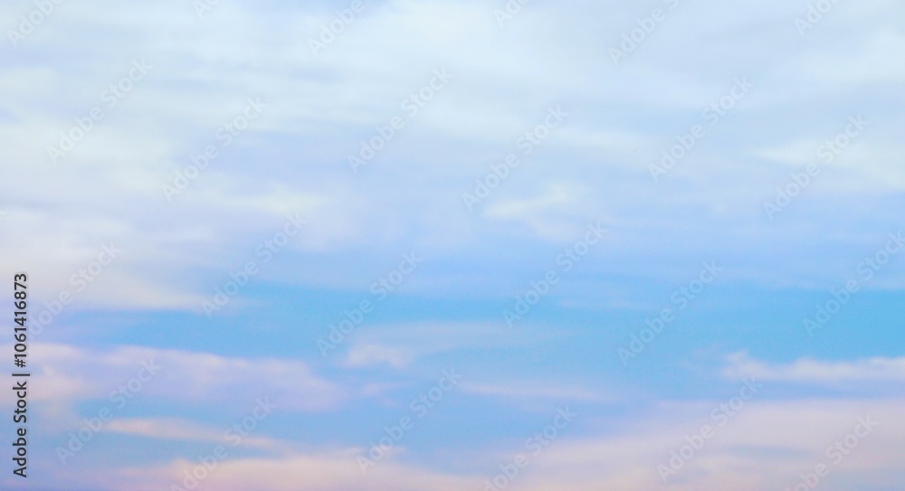 Naklejka premium a clear afternoon sky with beautiful white clouds