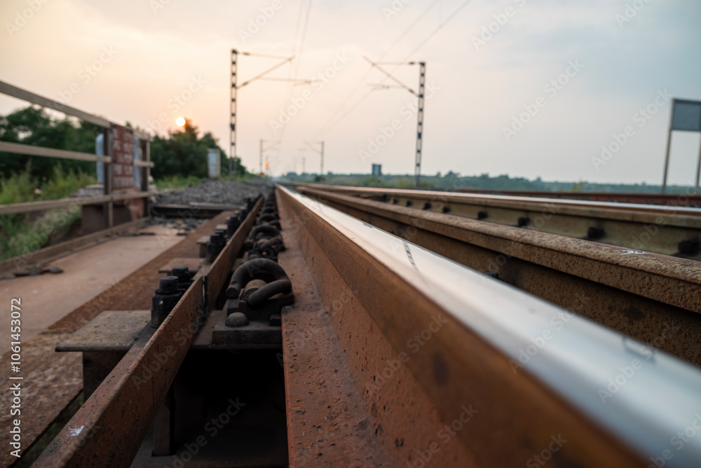Naklejka premium Railway track in India. Indian Railways Diesel-Electric Multiple Unit train