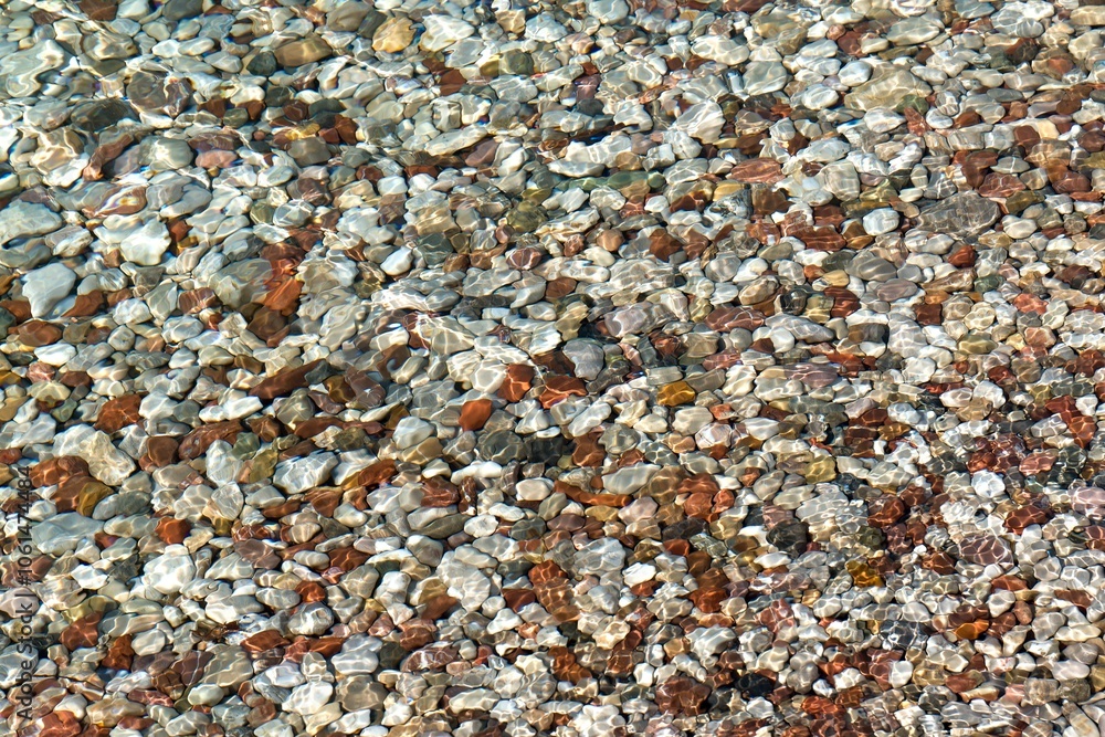 Pebbles in the Ionias sea at Alikes beach in Aigio town. Peloponnese. Greece. Europe. Pebbles in the Ionias sea at Alikes beach in Aigio town. Peloponnese. Greece. Europe.