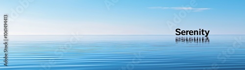 Tranquil seascape under a clear blue sky reflecting calmness and serenity.