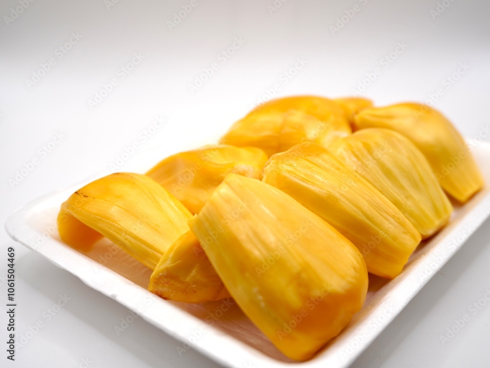 Close up image of golden-yellow flesh of ripe jackfruit isolated on a white background. Sweet of flesh jackfruit Close up image of golden-yellow flesh of ripe jackfruit isolated on a white background. Sweet of flesh jackfruit