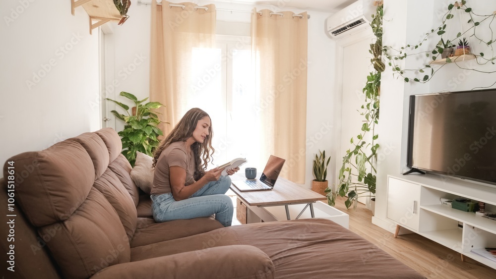 Serious woman reading diary in living room at home Serious woman reading diary in living room at home