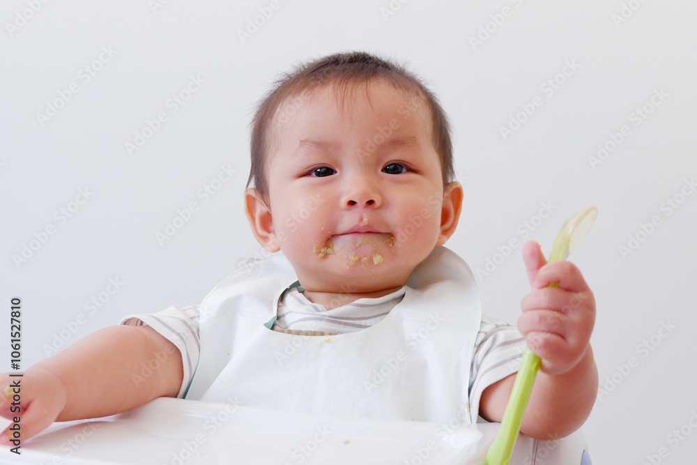Cute baby sitting eating and smiling. Cute baby sitting eating and smiling.