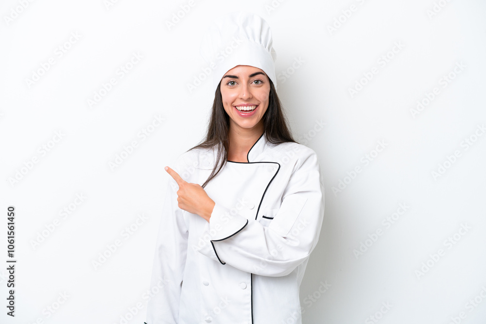 Young chef woman over white background pointing back Young chef woman over white background pointing back