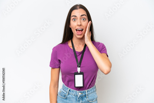 Young caucasian woman with ID card isolated on white background with surprise and shocked facial expression