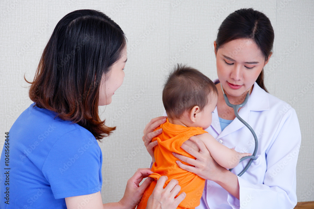 Female doctor examining a sick young child, Pediatrician concept. Female doctor examining a sick young child, Pediatrician concept.