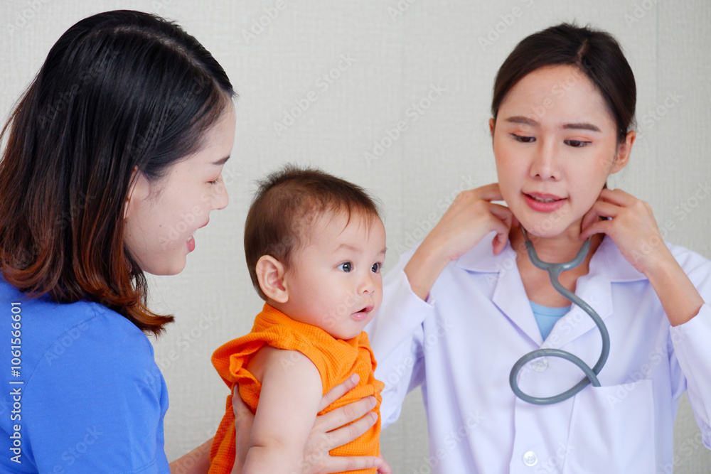 Female doctor examining a sick young child, Pediatrician concept, Pediatrician, Pediatrics. Female doctor examining a sick young child, Pediatrician concept, Pediatrician, Pediatrics.