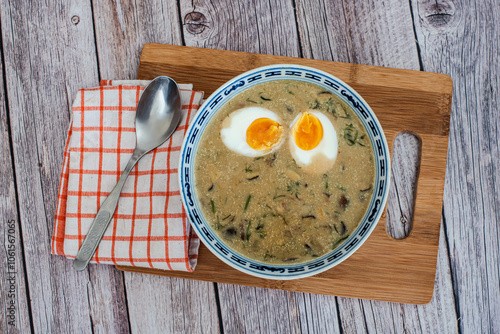 Traditional Czech Creamy Mushroom Soup Kulajda with Egg, Potatoes, and Dill photo