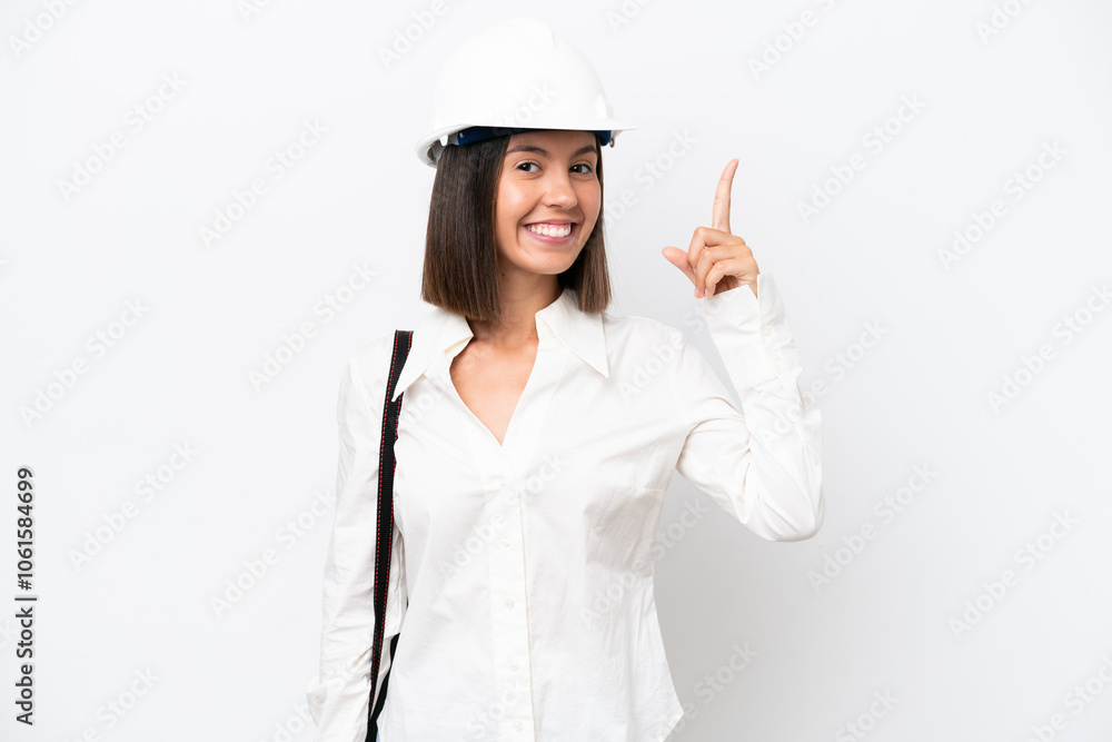 Young architect woman with helmet and holding blueprints isolated on white background pointing up a great idea Young architect woman with helmet and holding blueprints isolated on white background pointing up a great idea