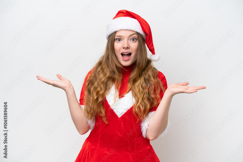 Young caucasian woman with Christmas dress isolated on white background with shocked facial expression