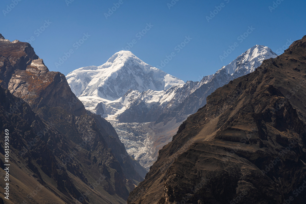Morning landscape view of snowcapped Diran peak in Karakoram mountain range, Karimabad, Hunza, Gilgit-Baltistan, Pakistan Morning landscape view of snowcapped Diran peak in Karakoram mountain range, Karimabad, Hunza, Gilgit-Baltistan, Pakistan