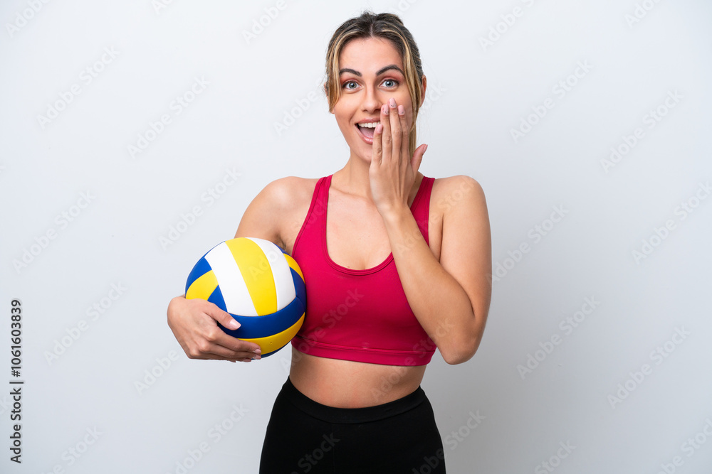 Young caucasian woman playing volleyball isolated on white background with surprise and shocked facial expression Young caucasian woman playing volleyball isolated on white background with surprise and shocked facial expression