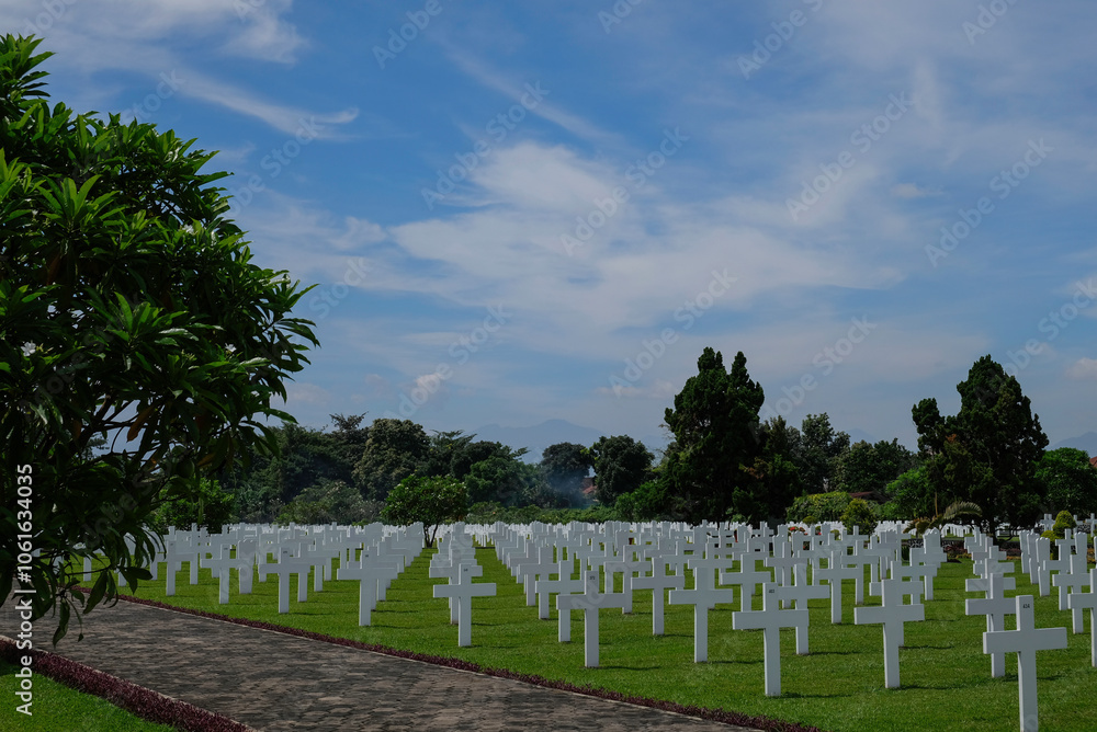 Bandung, Indonesia - January 8, 2023: Ereveld Pandu is one of 7 Netherlands war cemeteries in Indonesia where around 4000 war victims are buried. Bandung, Indonesia - January 8, 2023: Ereveld Pandu is one of 7 Netherlands war cemeteries in Indonesia where around 4000 war victims are buried.