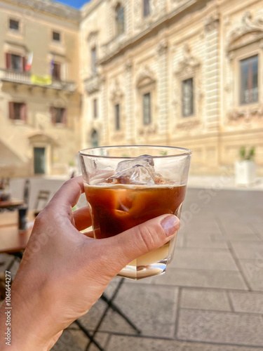 hand holds cold coffee known as leccese in Lecce, Italy