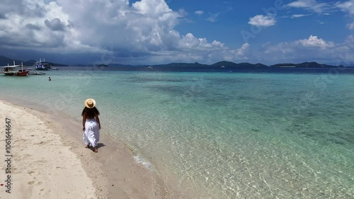 Drone View of Woman in White Dress Walking on Sandy Spit with Crystal Clear Waters and Boats Nearby — Idyllic Philippine Island in High-Resolution