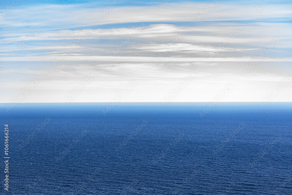 Norwegian fjord, with bright blue sky and the typical mountains of the North Cape Norwegian fjord, with bright blue sky and the typical mountains of the North Cape