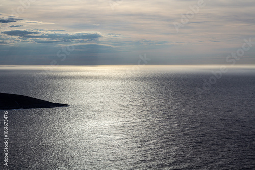 Norwegian fjord, with bright blue sky and the typical mountains of the North Cape 