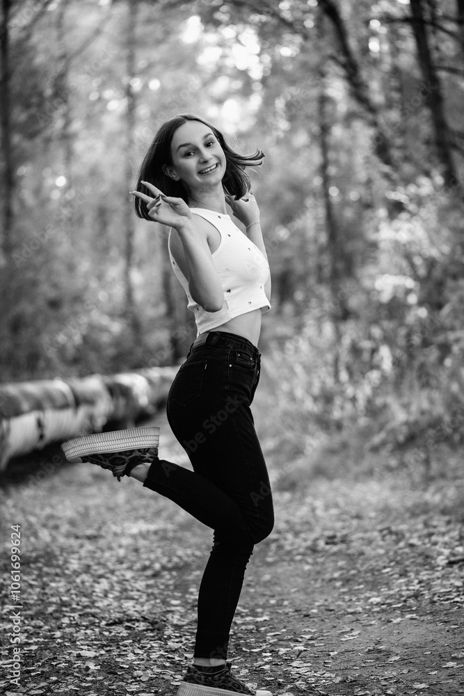 Portrait of a beautiful young girl in an urban environment. Black and white photo. Portrait of a beautiful young girl in an urban environment. Black and white photo.