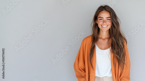 Australian woman wearing traditional cloak wool poncho isolated on grey photo