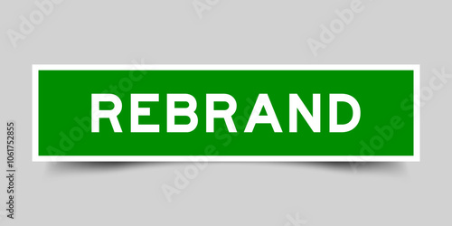 Square sticker label with word rebrand in green color on gray background