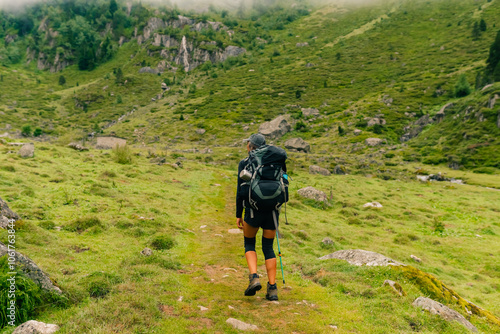 girl Hiker on countryside landscape in the Pyrenees, Pyrenees in France. photo