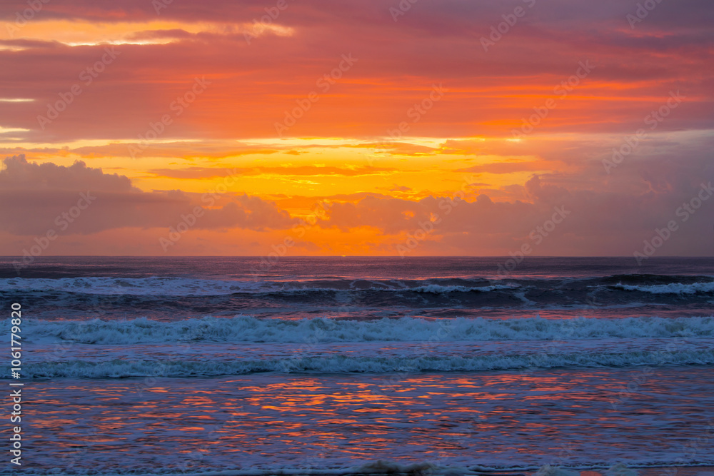Fototapeta premium Colourful sunset skies over ocean waves. Gold Coast, Australia