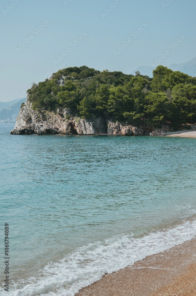 view from a private beach of rocks with trees and the Adriatic Sea in Montenegro
