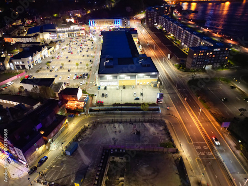 High Angle Night View of Dover Coastal City of South Eastern County of Kent England, United Kingdom. The Illuminated Footage Was Captured with Drone's Camera after Sunset Night of April 20th, 2024 photo