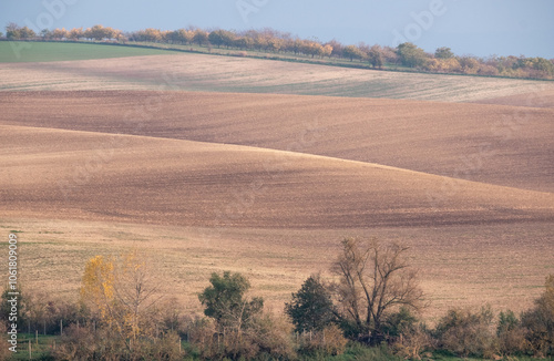 Stunning undulating arable agricultural landscape, photographed in autumn in south Moravia in the Czech Republic. The area is known as Moravian Tuscany and is full of rolling hills used for farming.