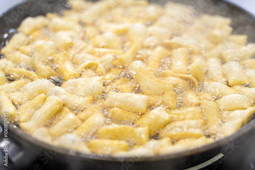 The dough is fried in pieces in a pan in oil (Pa Thong Ko), Baursaks or chak chak is a traditional national dish. photo