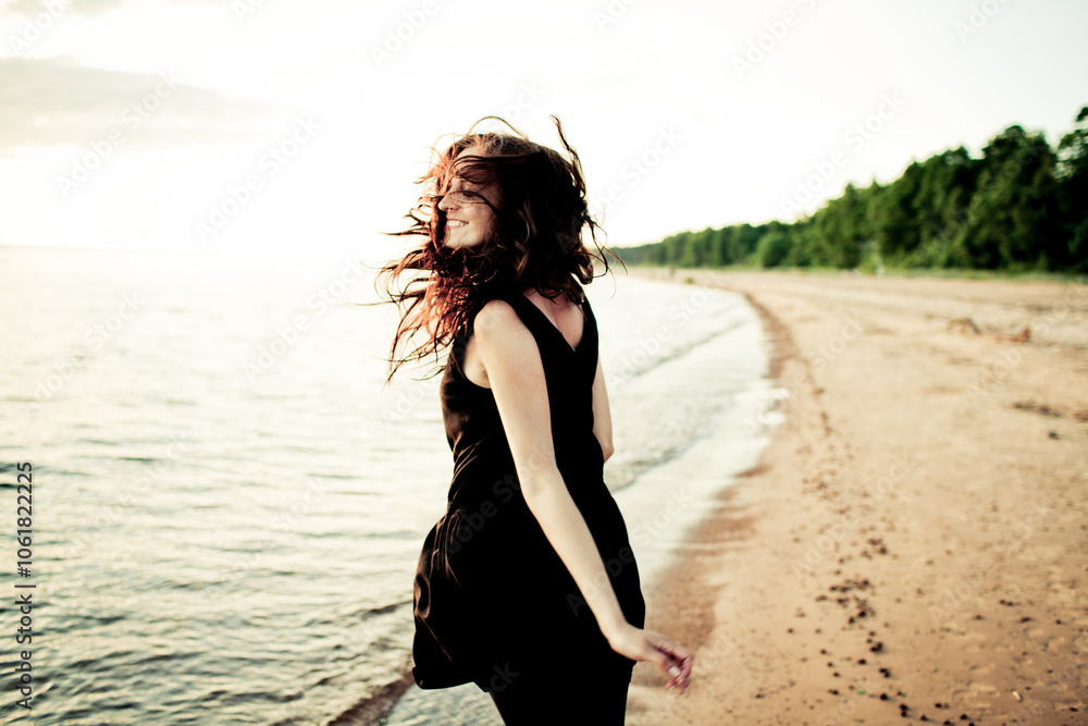 Woman Joyfully Running on the Beach at Sunset Woman Joyfully Running on the Beach at Sunset