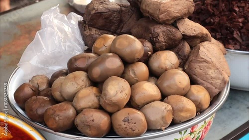 close up of eggs and processed bacem for the culinary menu Gudeg typical of Yogyakarta Indonesia photo