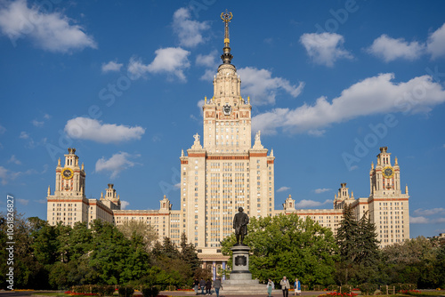 MOSCOW, RUSSIA - 30 SEPTEMBER 2023: View of the Lomonosov Moscow State University building through the park's trees on an summer day.