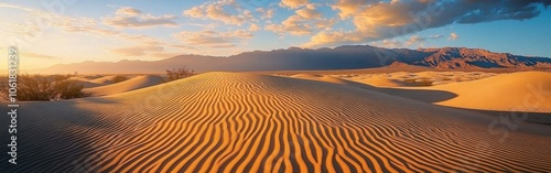 Breathtaking view of the Mesquite Flat Sand Dunes at sunrise showcasing undulating patterns and a serene desert landscape