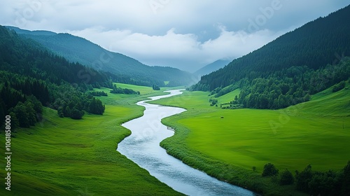 A winding river in a green valley.