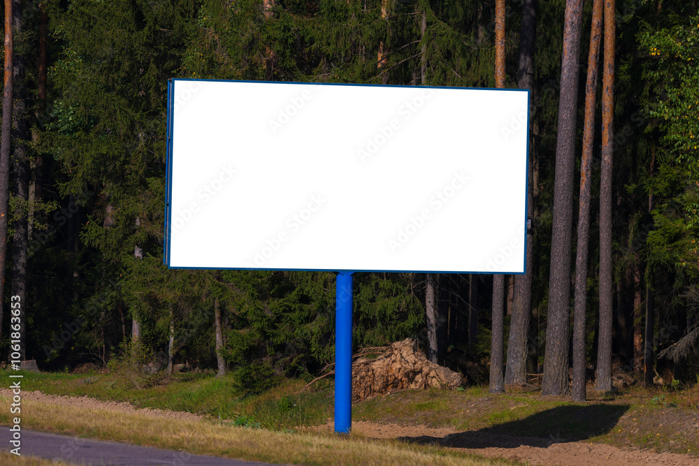 Fototapeta premium White billboard along the highway. Background for design and advertising. 