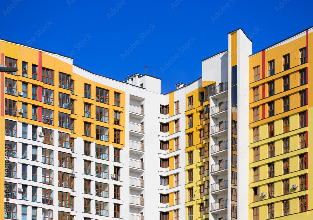 Fototapeta premium Modern buildings, walls and windows. City view on a sunny day. 