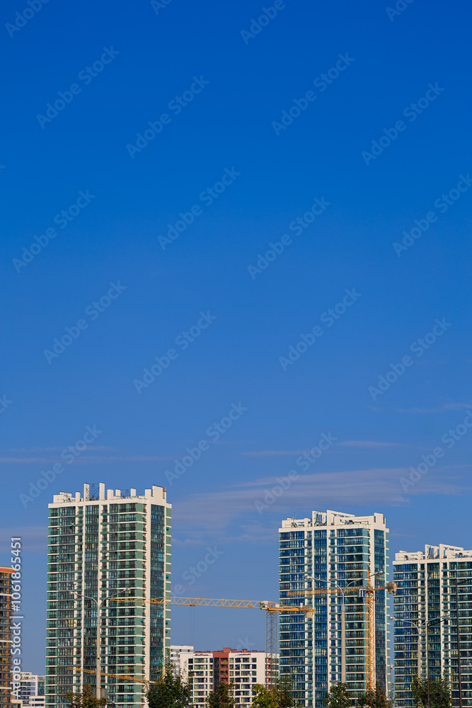 Modern buildings, walls and windows. City view on a sunny day. Modern buildings, walls and windows. City view on a sunny day.