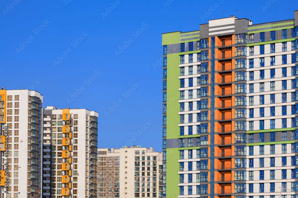 City view, modern buildings and skyscrapers against the blue sky. City view, modern buildings and skyscrapers against the blue sky.