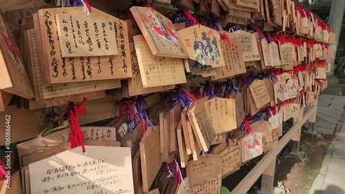 Small wooden plaques to write prayers and wishes (Ema) in Akasaka Hikawa shrine in Tokyo, Japan