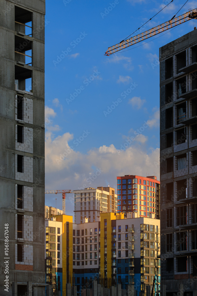 Fototapeta premium City view, modern buildings and skyscrapers against the blue sky.