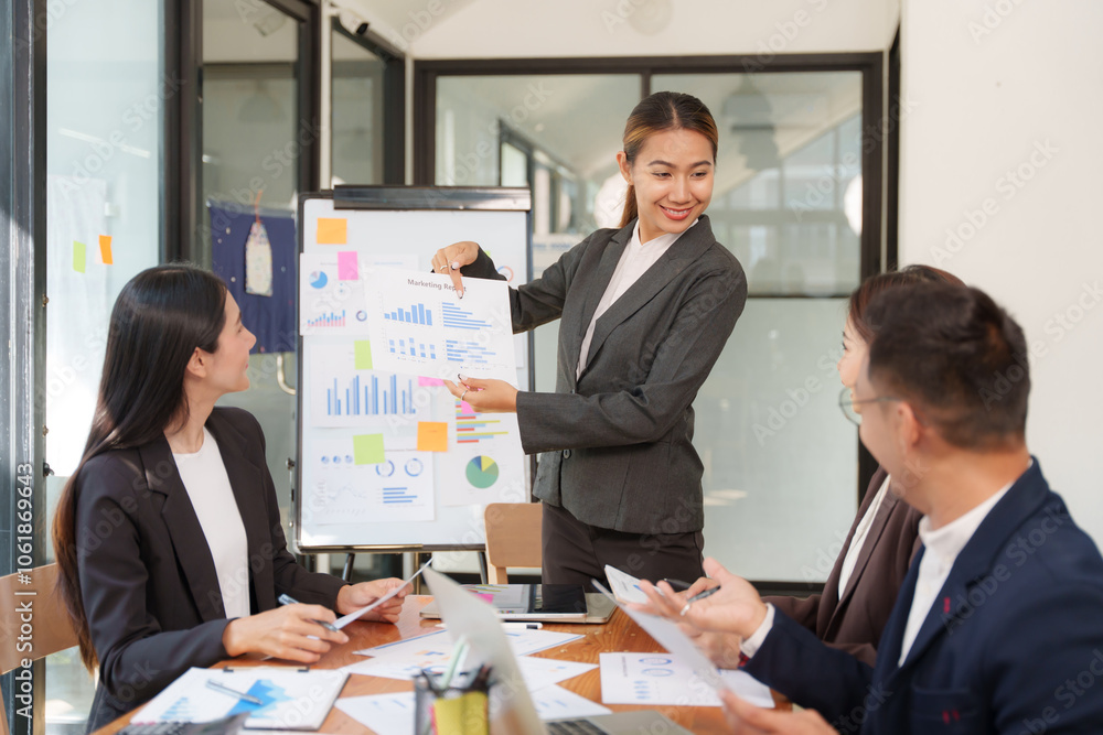 A group of Asian businessmen is Meeting to discuss presentations exchange knowledge Presentation about office work A group of Asian businessmen is Meeting to discuss presentations exchange knowledge Presentation about office work