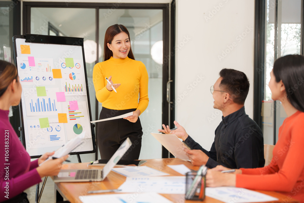 Group of Asian businessmen are sitting in a meeting, talking, exchanging knowledge. Presentation about office work Group of Asian businessmen are sitting in a meeting, talking, exchanging knowledge. Presentation about office work