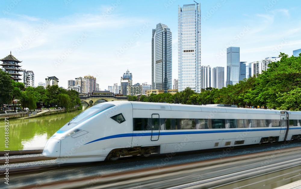 Naklejka premium High-speed rail speeds on Bridges and the modern city skyline of chongqing, China