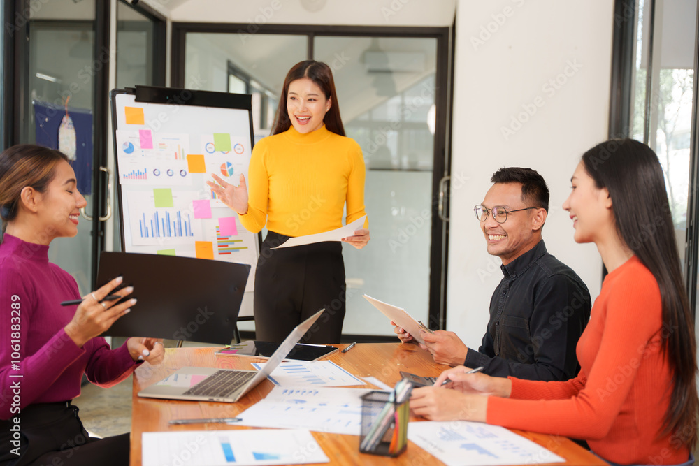Group of Asian businessmen are sitting in a meeting, talking, exchanging knowledge. Presentation about office work