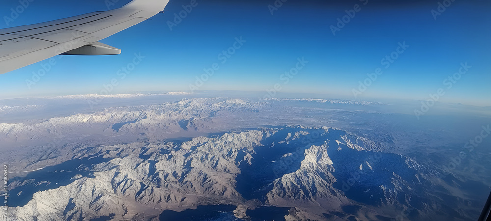 wing of airplane view of mountains wing of airplane view of mountains