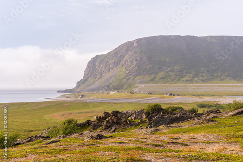 Picturesque landscapes of Northern Norway in Molvik near Berlevag. Molvik is a small fishing village whichs on the shore of Tanafjord. photo