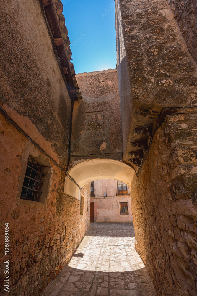 Picturesque street with an arch in a rustic village, Medinaceli, Spain Picturesque street with an arch in a rustic village, Medinaceli, Spain